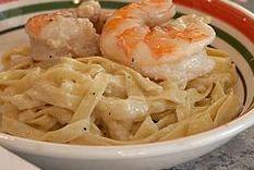 Shrimp Scampi · Served with your choice pasta in a buttery garlic sauce or salad.