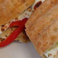 Caprese Panini · Fresh Mozzarella, Tomatoes, Basil & Sprinkled with Extra Virgin Olive Oil on a homemade panini