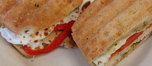 Caprese Panini · Fresh Mozzarella, Tomatoes, Basil & Sprinkled with Extra Virgin Olive Oil on a homemade panini