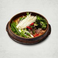 Spicy Goat Stew 흑염소 전골 | 炖黑山羊汤肉锅子 · Traditional spicy goat stew with assorted vegetables, and wild sesame.