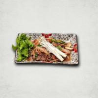 Bulgogi 불고기 | 烤牛肉 · Thin slices of marinated beef sirloin with assorted mushrooms and vegetables with vermicelli...