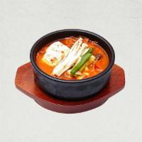 Kimchi Jjigae 김치 찌개 | 泡菜汤 · Spicy stew made with ripened kimchi, pork belly, and tofu.