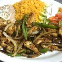 Fajita Steak · Cooked strips of meat wrapped in a tortilla. Grilled onions and peppers with meat served on ...