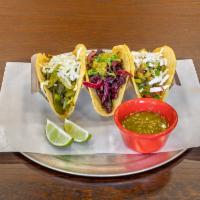 Nopalitos Taco Dinner · 3 hand made tortilla tacos with beans, nopales cactus, tomato, onion, cilantro, and queso fr...
