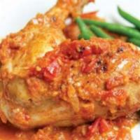 Chicken Kashmiri · Tender pieces of chicken cooked with nuts in a creamy sauce. Served with rice.