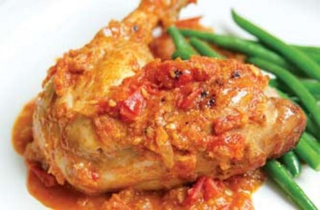 Chicken Kashmiri · Tender pieces of chicken cooked with nuts in a creamy sauce. Served with rice.