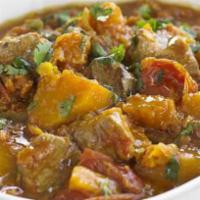 Lamb Dhansak · Boneless lamb cooked with different lentils and sweet sour and light hot spices. Served with...