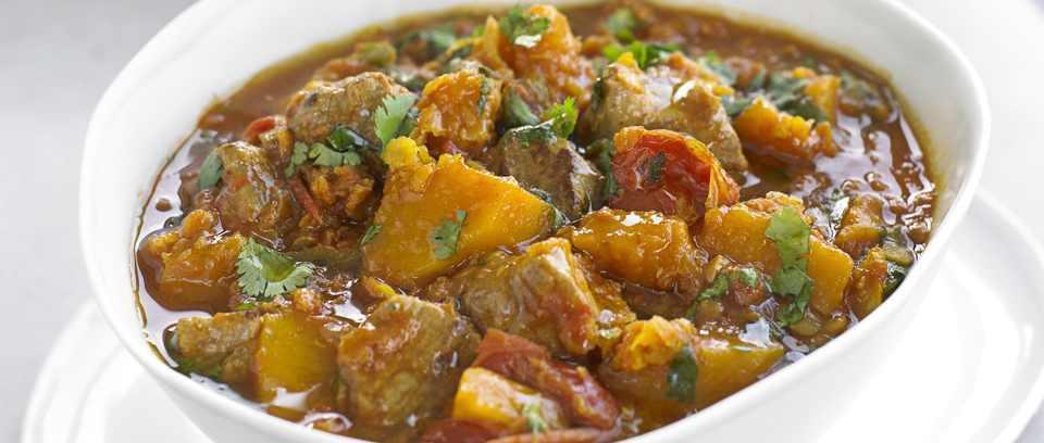Lamb Dhansak · Boneless lamb cooked with different lentils and sweet sour and light hot spices. Served with rice.
