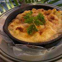 Truffle Mac n Queso · Three cheeses baked into macaroni pasta with truffle.