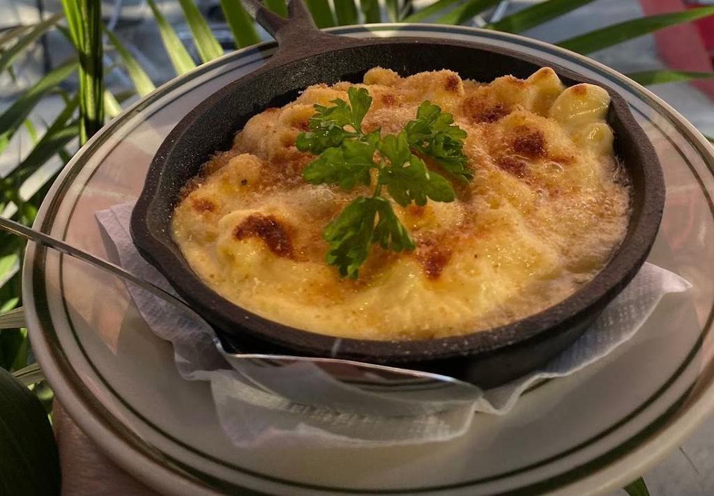 Truffle Mac n Queso · Three cheeses baked into macaroni pasta with truffle.