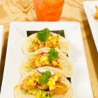 Tacos de Chicharron de Camaron · Crispy shrimps, guacamole, mango pico de gallo, and chipotle aioli
