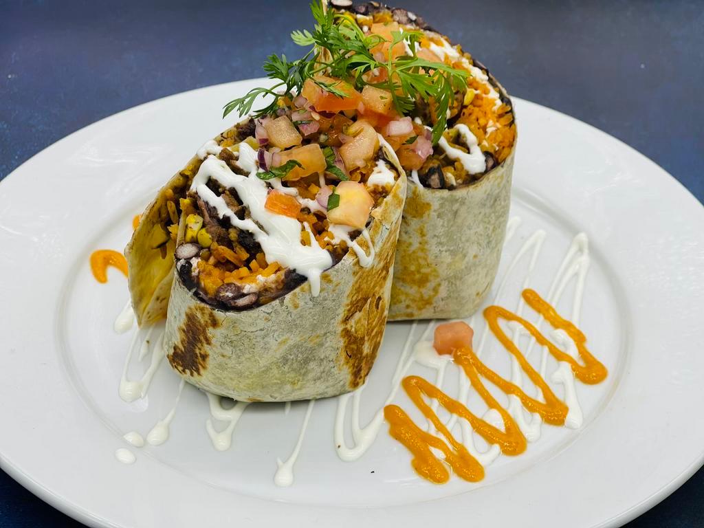 Burrito de Pollo · Flour tortilla stuffed with Marinated grilled chicken thighs, black beans, grilled corn, Monterey and Oaxaca cheese, Mexican rice, pico de gallo, and Mexican sour cream.