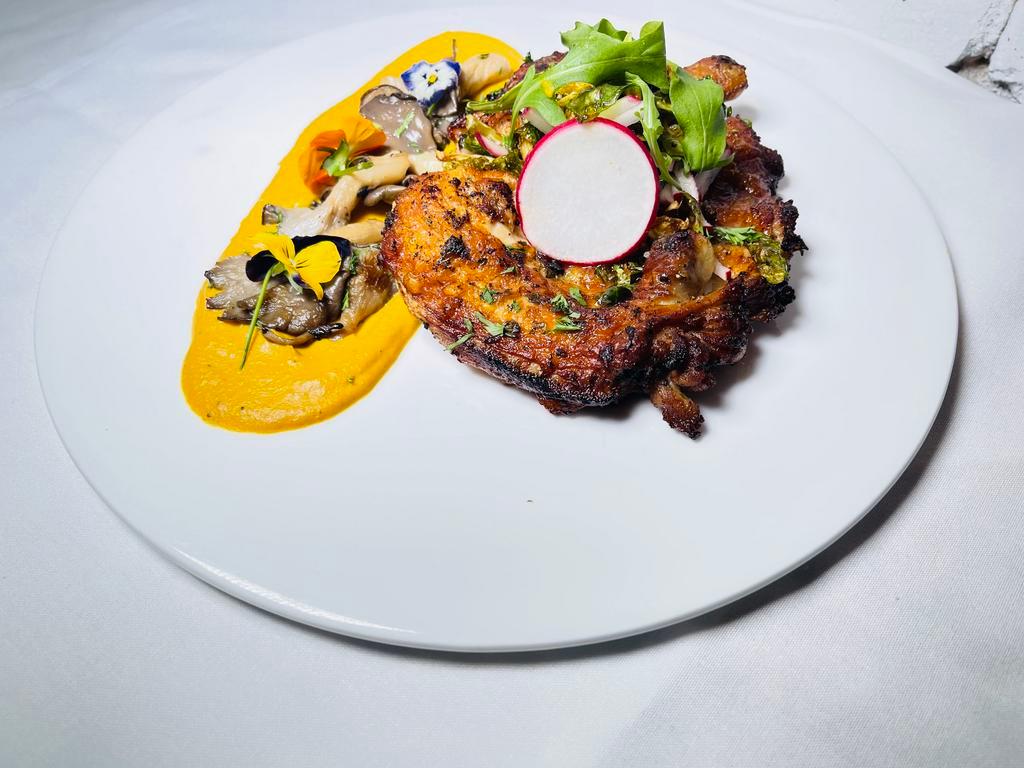 Gallinita loca  · Pan roasted organic Cornish hen marinated in fresh herbs over roasted butternut squash puree, grilled oysters mushrooms topped with crispy brussels sprouts salad.