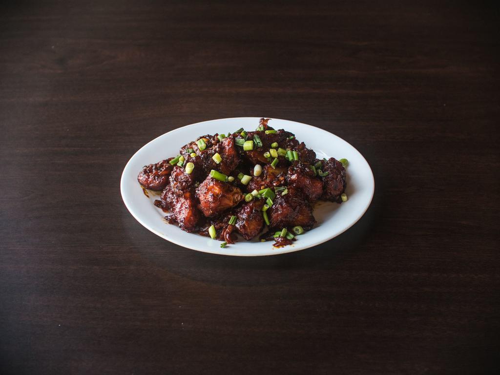 Gobi Manchurian (GRAVY) · Marinated cauliflower deep-fried & cooked with ginger, garlic, onion and soy sauce