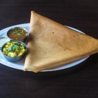 3. Mysore Masala Dosa · Thin rice crepes layered with hot chutney filled with potatoes and onions.