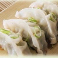 Vegetable Dumplings · Streamed mix veggie dumpling served with sweet soy vinaigrette.