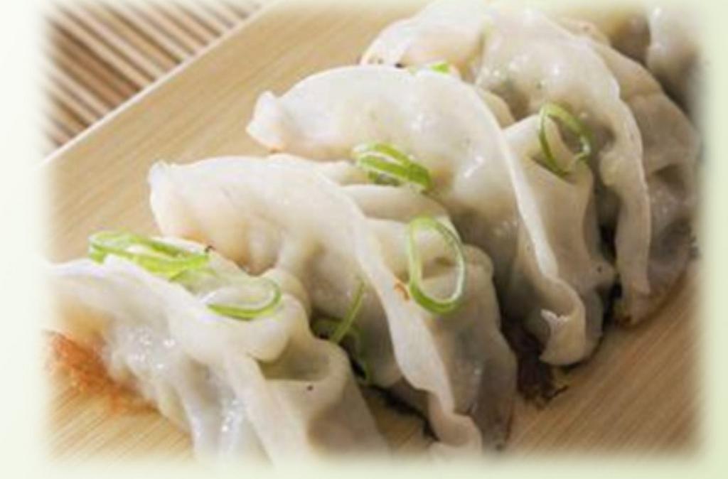 Vegetable Dumplings · Streamed mix veggie dumpling served with sweet soy vinaigrette.