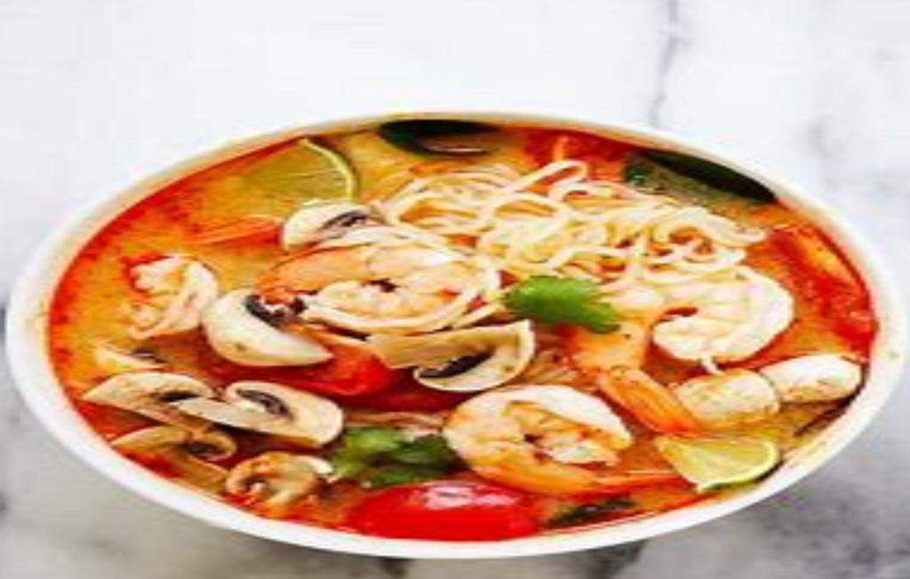 Tom Yum Seafood Noodle Soup · Thin rice noodles, shrimp, calamari, fish ball, scallion and bean sprout in tom yum broth.