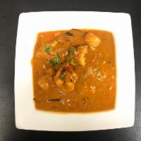 Chicken Tikka Masala · Cubes of chicken breast skewered in tandoor and simmered in tomato and onion with cashew nut...