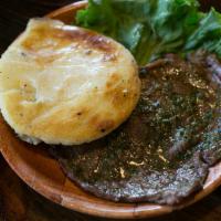 Carne Asada Arepa · Roast meat. Arepa con carne asada. Sin salsas. Served with corn cake with cheese and grill s...