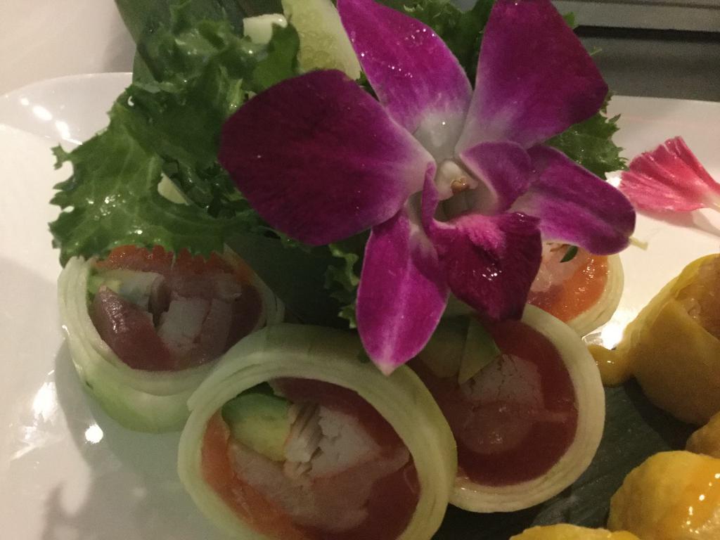 Naruto Roll · Thinly sliced cucumber, wrapped tuna, salmon, yellowtail, avocado and tobiko.