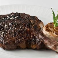20 oz Bone-In Ribeye · All of our steaks are prepared with our Signature Strip House salt and pepper char. Served w...