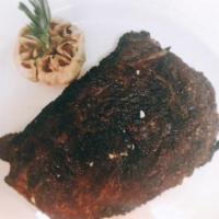 14 oz Dry Aged Ribeye · All of our steaks are prepared with our Signature Strip House salt and pepper char. Served w...