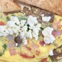 Greek Omelette · Gyro meat, diced tomatoes, baby spinach, onions, green peppersand topped with feta cheese.
