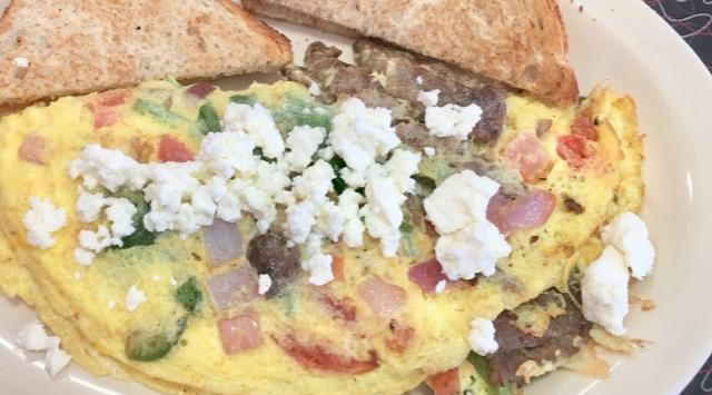 Greek Omelette · Gyro meat, diced tomatoes, baby spinach, onions, green peppersand topped with feta cheese.