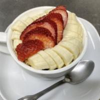 Breakfast Granola Cup · Honey almond granola, strawberries, banana and milk.