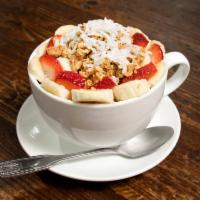 Acai Bowl Breakfast  · Organic acai, honey almond granola, strawberries, bananas and coconut flakes.