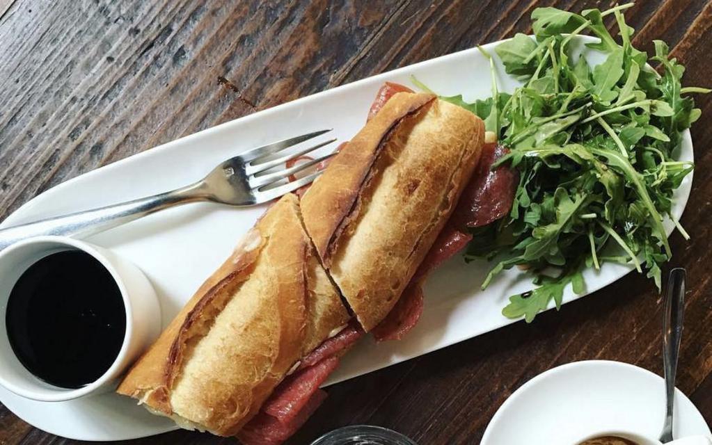 Genoa Salami Baguette Sandwich · Genoa salami and cheddar cheese. Toasted and served with arugula salad.