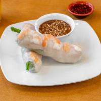 A1. Goi cuon Tom Thit · Pork and shrimp salad rolls 2 rolls. Rice paper wrapped pork, shrimp, vermicelli, lettuce, T...