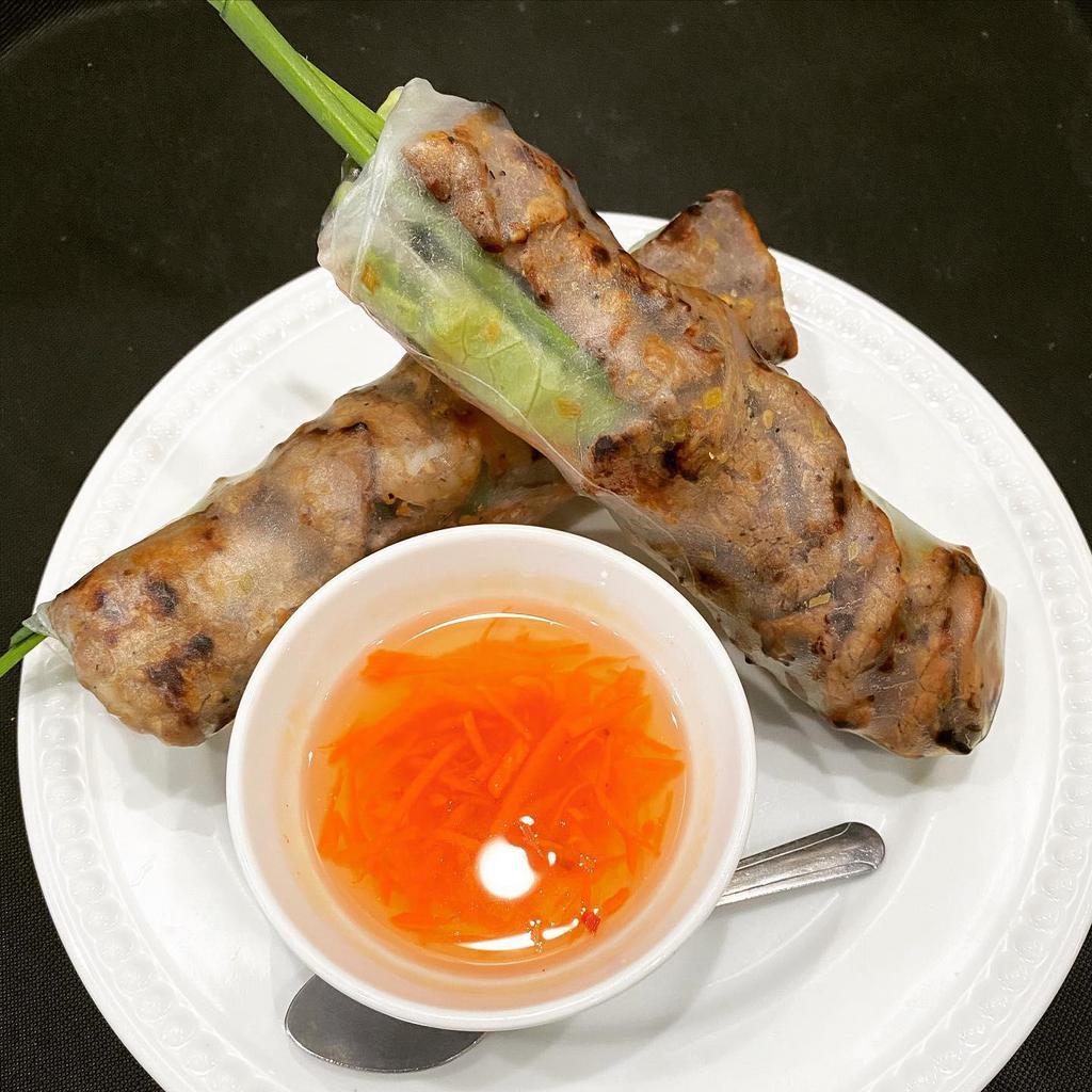 A4. Nem Nuong Cuon · Vietnamese grilled pork sausage salad rolls 2 rolls. Rice paper wrapped Vietnamese grilled Pork Sausage, lettuce, cucumber, Thai basil, mint, carrot & daikon, beansprout, chives. Served with homemade sauce.
