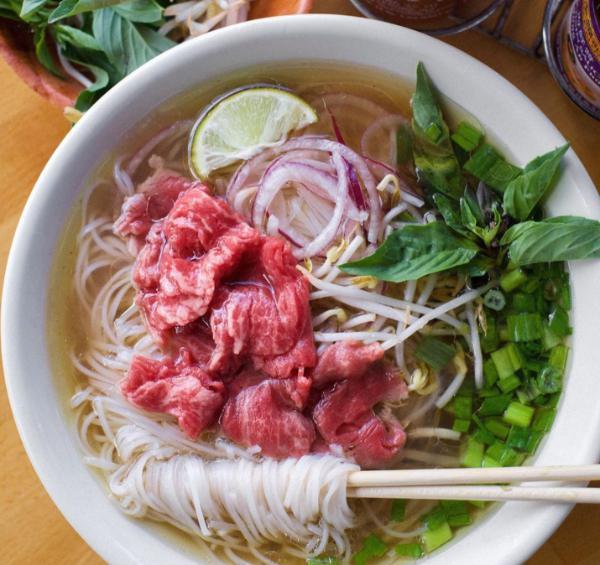 #1. Pho Tai · Eye of round steak. Eye of round steak with noodle and beef broth. Topped with white onion, green scallion and cilantro. Served with side of beansprout, Thai basil, jalapeno sliced and wedge of lime.
