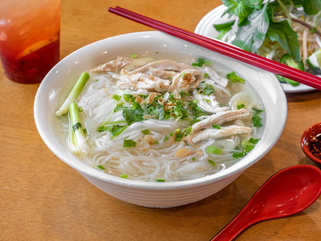#13. Pho Ga · Chicken. Chicken with noodle and chicken broth. Topped with white onion, green scallion and cilantro. Served with side of beansprout, Thai basil, jalapeno sliced and wedge of lime.
