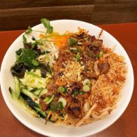 B4. Bun Thit Nuong · Rice vermicelli bowl with grilled pork skewers.
