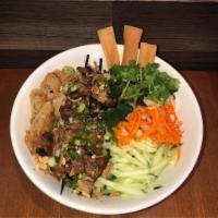 B5. Bun Bi, Thit Nuong · Rice vermicelli bowl with julienned pork skin with shredded pork and grilled pork skewers.