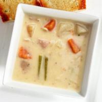 Creamy Potato Soup · Hearty new potatoes, diced carrots, onions & celery in a rich creamy base.  Served with garl...