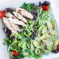 Signature Chicken Deli Salad · Grilled chicken & pesto pasta on a bed of romaine & spring mix lettuce with pine nuts, kalam...