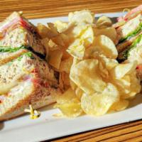 Toasted Tuna Club · Triple decker multigrain bread, tuna salad, lettuce, tomato, bacon, mayonnaise, monterey jac...
