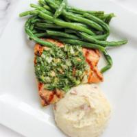 Mediterranean Salmon · Grilled salmon fillet topped with house-made lemon herb sauce and choice of two sides