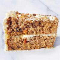 Carrot Cake Slice · A slice of carrot cake with cream cheese frosting.  Contains nuts.