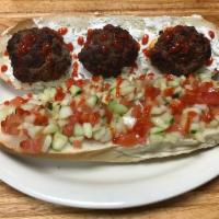 5. The Moroccan Meatball Sandwich · Kefta ground beef with chopped tomato and cucumber salad and Moroccan olives on Italian hero.