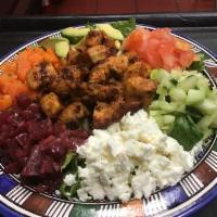 Moroccan Garden Salad · Served with lettuce, avocado, tomato, beets, carrots, chickpeas and feta cheese. Add grilled...
