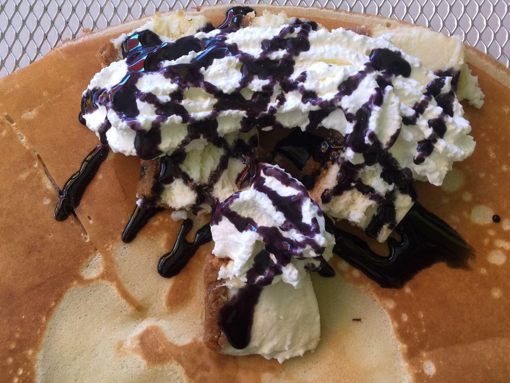 17. Cheesecake, Whipped Cream and Blueberry Sauce · 