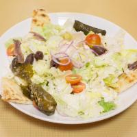 Greek Salad · Feta cheese, anchovies, olives, peppers, lettuce, tomato and pita bread.
