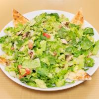 Chopped Salad · Grilled chicken over romaine lettuce, cucumbers, tomatoes, onions, mushrooms, broccoli and p...