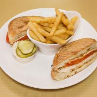Chicken and Mozzarella Panini · Served with roasted peppers and balsamic vinaigrette.