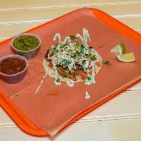 Shrimp Signature Taco · Grilled gulf shrimp, pico de gallo, lemon bay slaw, cilantro, and cilantro cream.